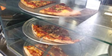 Pizza Slice Must Be Really Delicious To Be Served From Behind Bulletproof Glass